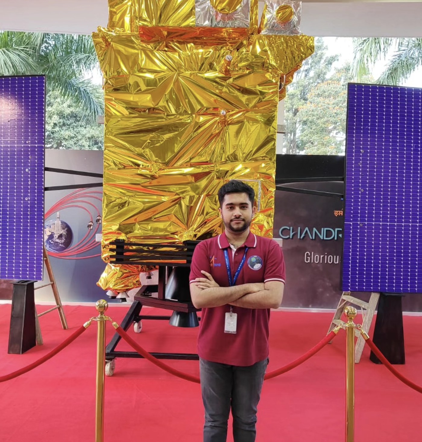 Debajyoti Chakrabarti standing in front of a Chandrayaan-3 lander display at ISRO